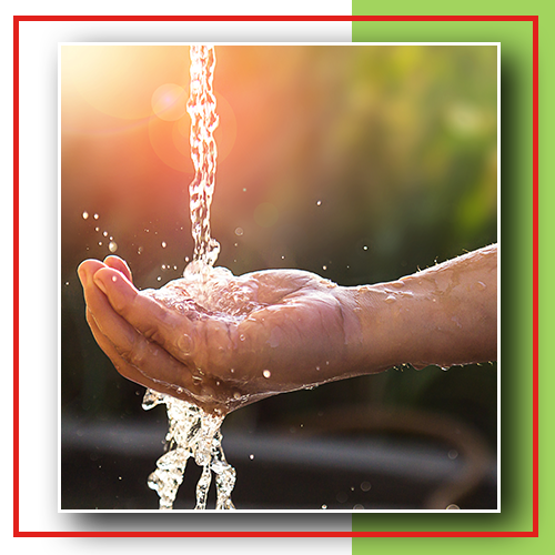 Image of fresh water running over a person's hand